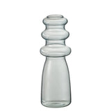 Vase Luna en verre bleu, présenté dans un salon moderne