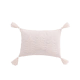 Coussin J-Line en coton blanc sur un lit décoré