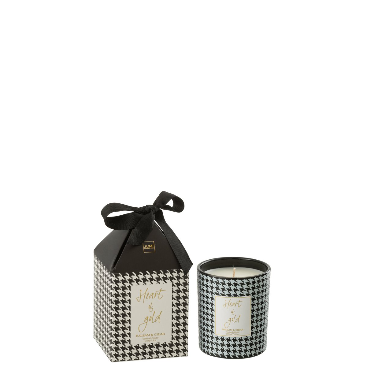 Bougie parfumée J-Line Coeur sur une table, ambiance chaleureuse