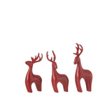 Figurine Renne Galvanic J-Line en rouge, mise en scène sur une table décorée.