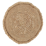 Coussin rond J-Line en osier naturel sur canapé beige