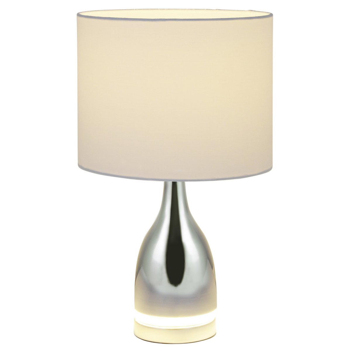 Lampe Cosima allumée sur une table moderne