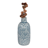 Vase bleu en céramique, angle latéral montrant la glaçure