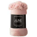 Ambiance cosy avec le pompon J-Line dans une chambre