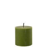 Ambiance chaleureuse avec la bougie J-Line sur une table extérieure.