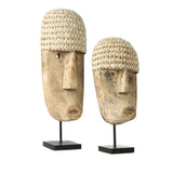 Le masque de cauri sur pied - moyen