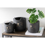 Vue latérale du pot de fleurs J-Line en céramique noir et or