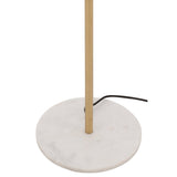 Gros plan sur l'abat-jour doré du lampadaire J-Line