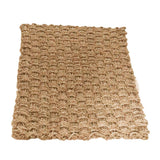 Tapis en jonc de mer Nirama utilisé comme paillasson