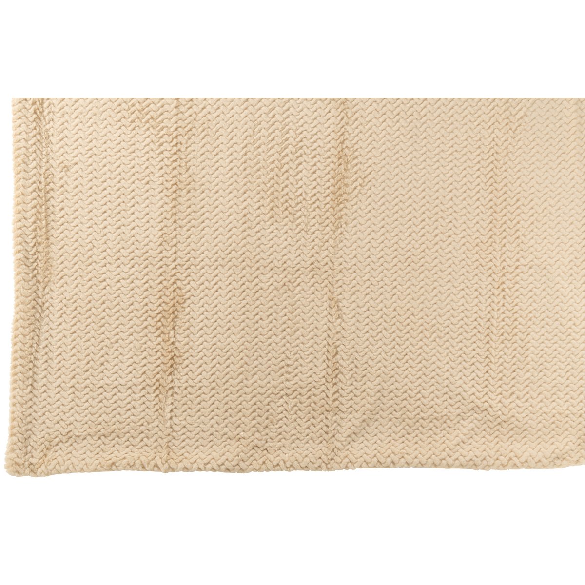 Couverture J-Line beige drapée sur un canapé moderne.