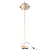 Détail du métal doré de la lampe sur pied J-Line