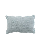 Coussin J-Line bleu en situation dans un salon moderne