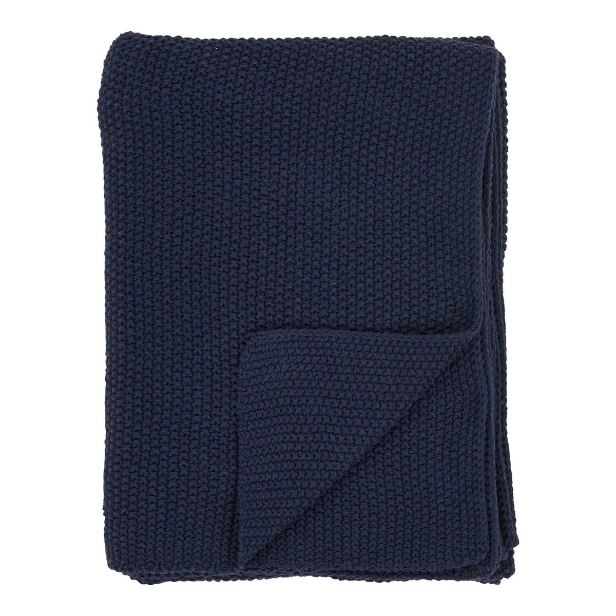 Plaid Santos en coton recyclé bleu sur un canapé moderne