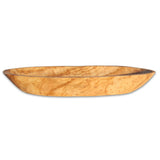 Bol ovale en bois d'olivier, sur une table en bois