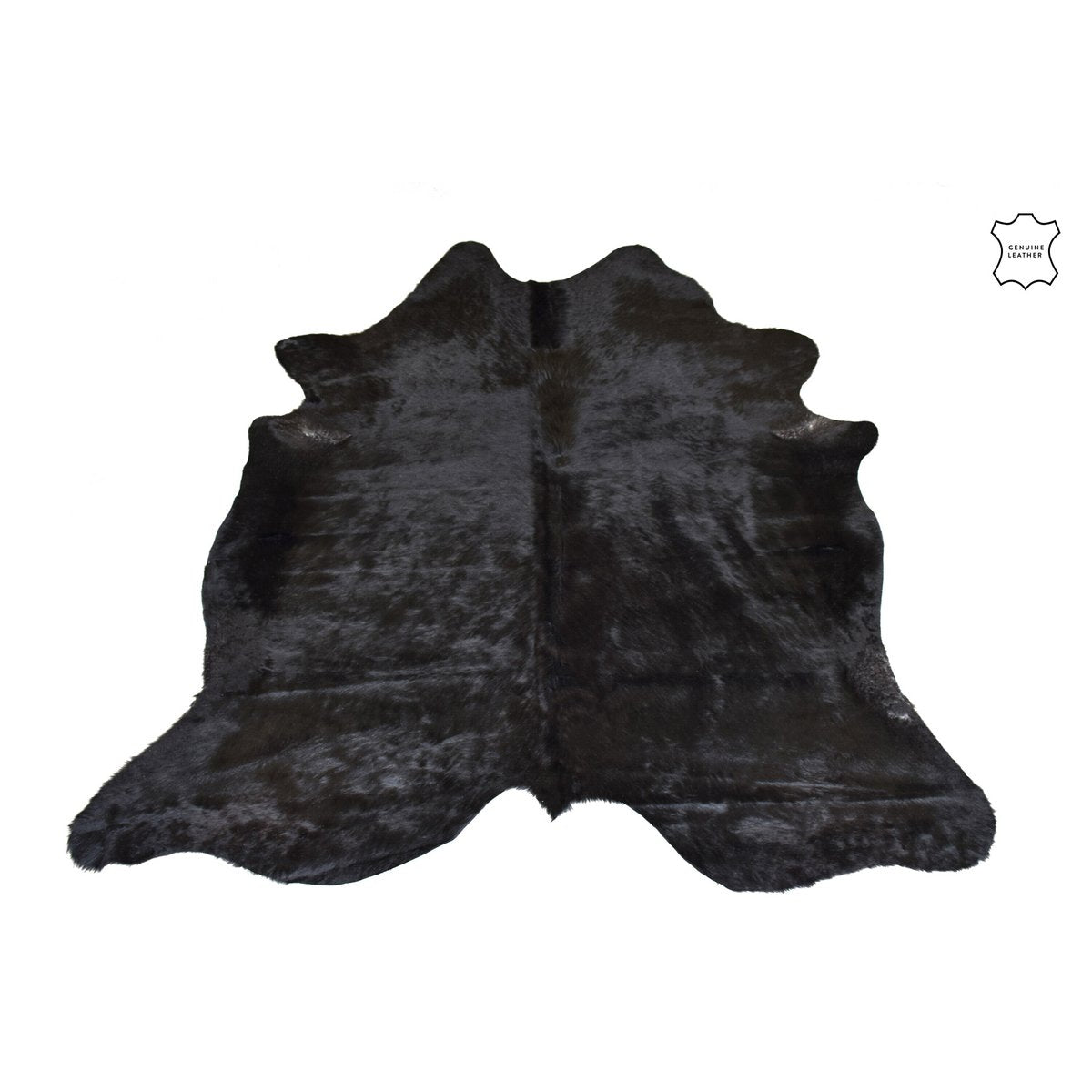 Vue d'ensemble du tapis peau de vache noir J-Line dans un intérieur élégant