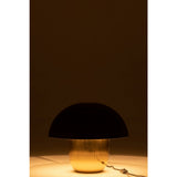 Vue rapprochée de l'abat-jour doré de la Table Champignon