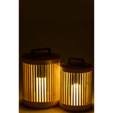 Lampe Cylindre J-Line éclairée dans un intérieur cosy