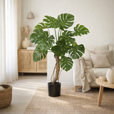 Plante artificielle Monstera verte en situation