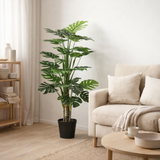Plante artificielle Monstera verte en situation