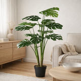 Plante artificielle Monstera verte en situation