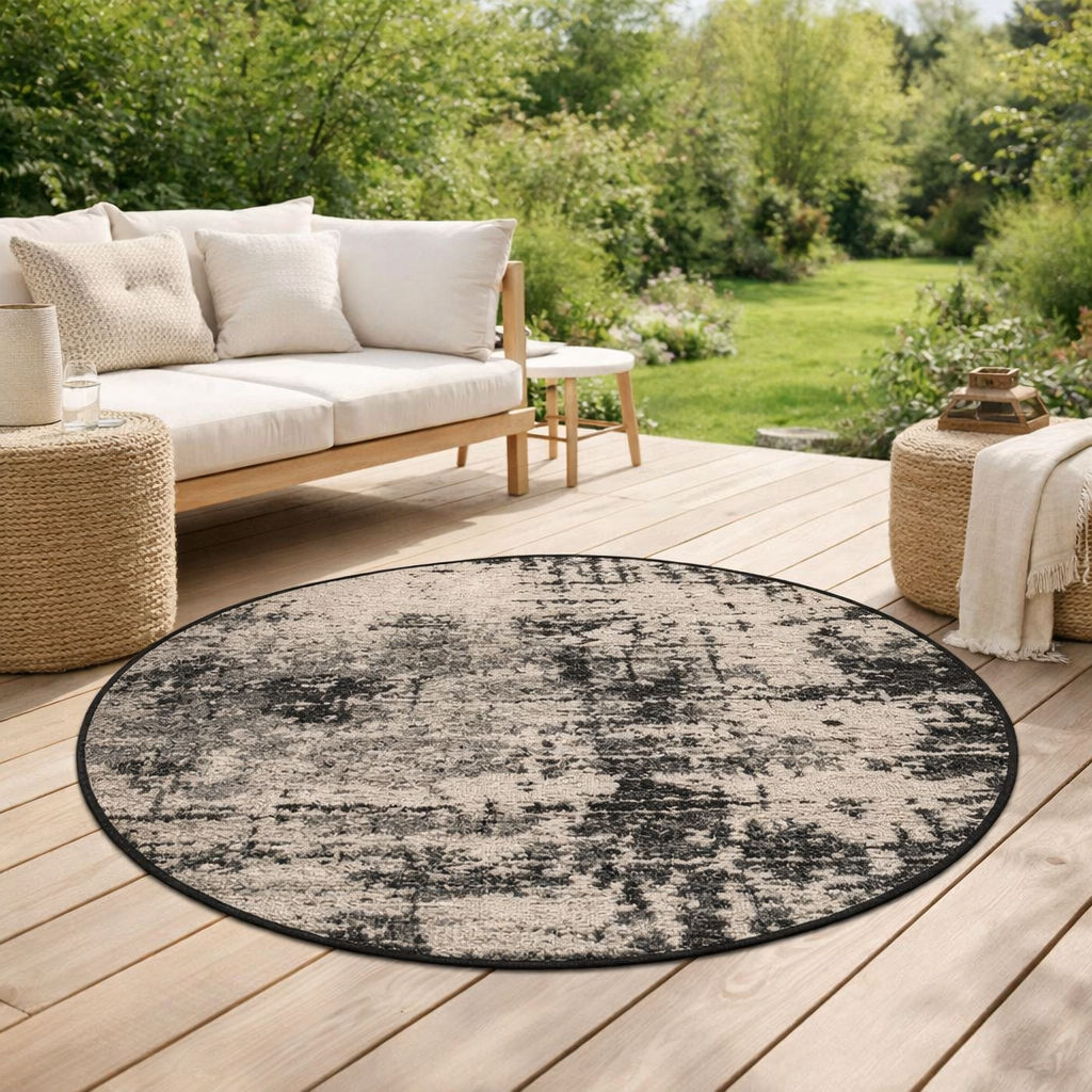Tapis Catania 2 outdoor Noir Diamčtre 160 cm en situation