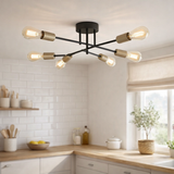 Plafond modo 6-flammes en métal en noir, versions or, prise E27, plafond pour salon, salle à manger, cuisine, couloir, couloir ou bureau avec un Øvon 54,5 cm en situation
