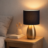 Lampe de table Aurum 33 cm de haut en or / noir, en métal et textile, avec version E14, éclairage pour salle à manger, salon, couloir ou bureau en situation