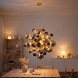 «Explosion» de la lampe en métal et en verre, versions G9, lampe suspendue pour salle à manger, salon, couloir ou bureau, Øca. 65 cm en situation