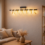 Plafond LED Belleza, lampe à plafond en métal moderne et plastique en noir, or et blanc, avec des LED fermement construites, 100 cm de long. L'éclairage idéal pour le salon, la salle à manger ou le bureau. en situation