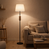 Lampe debout Elina 155 cm de haut, Ø 38 cm, métal en noir / marron, soufflerie texte en blanc, E27 en situation