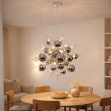 La lampe pendentielle explosion chromée en métal et en verre, versions G9, lampe suspendue pour salle à manger, salon, couloir ou bureau, Øca. 65 cm en situation