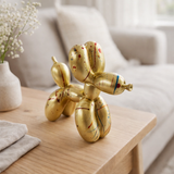 Éclaboussure d'or de chien de ballon de polyrésine en situation