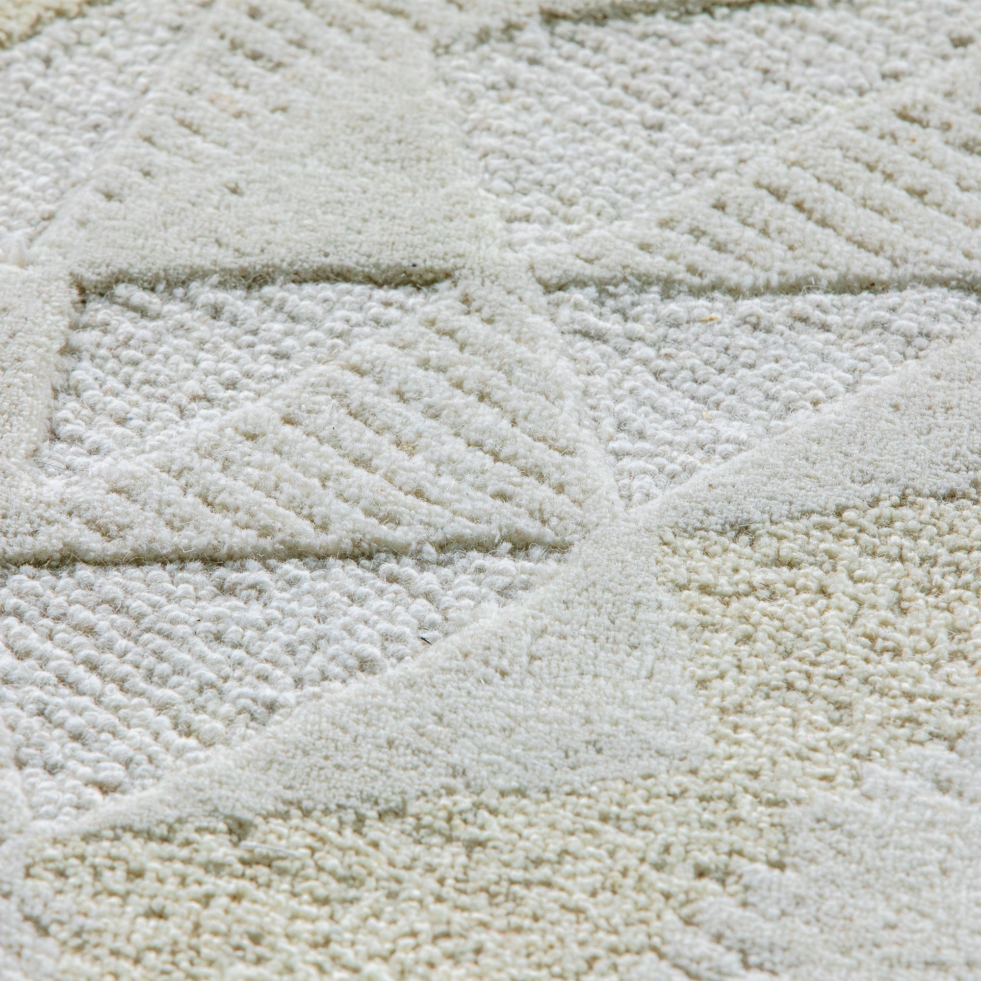 Texte de reliefs du tapis Bhoutan capturant la lumière